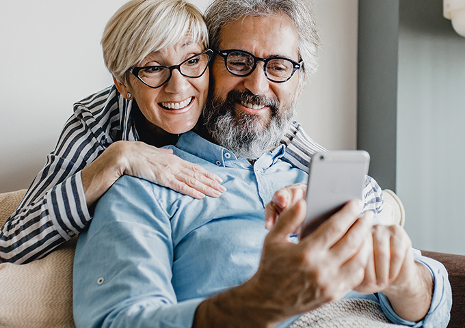 Couple looking at mobile phone